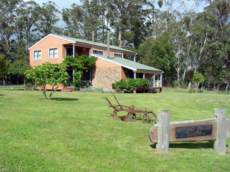 there is a building with a garden and fence