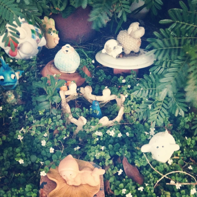 stuffed animal animals in a bunch of different plants