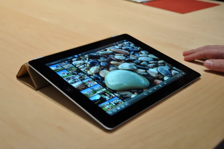 a close up s of an tablet device with stones on the screen