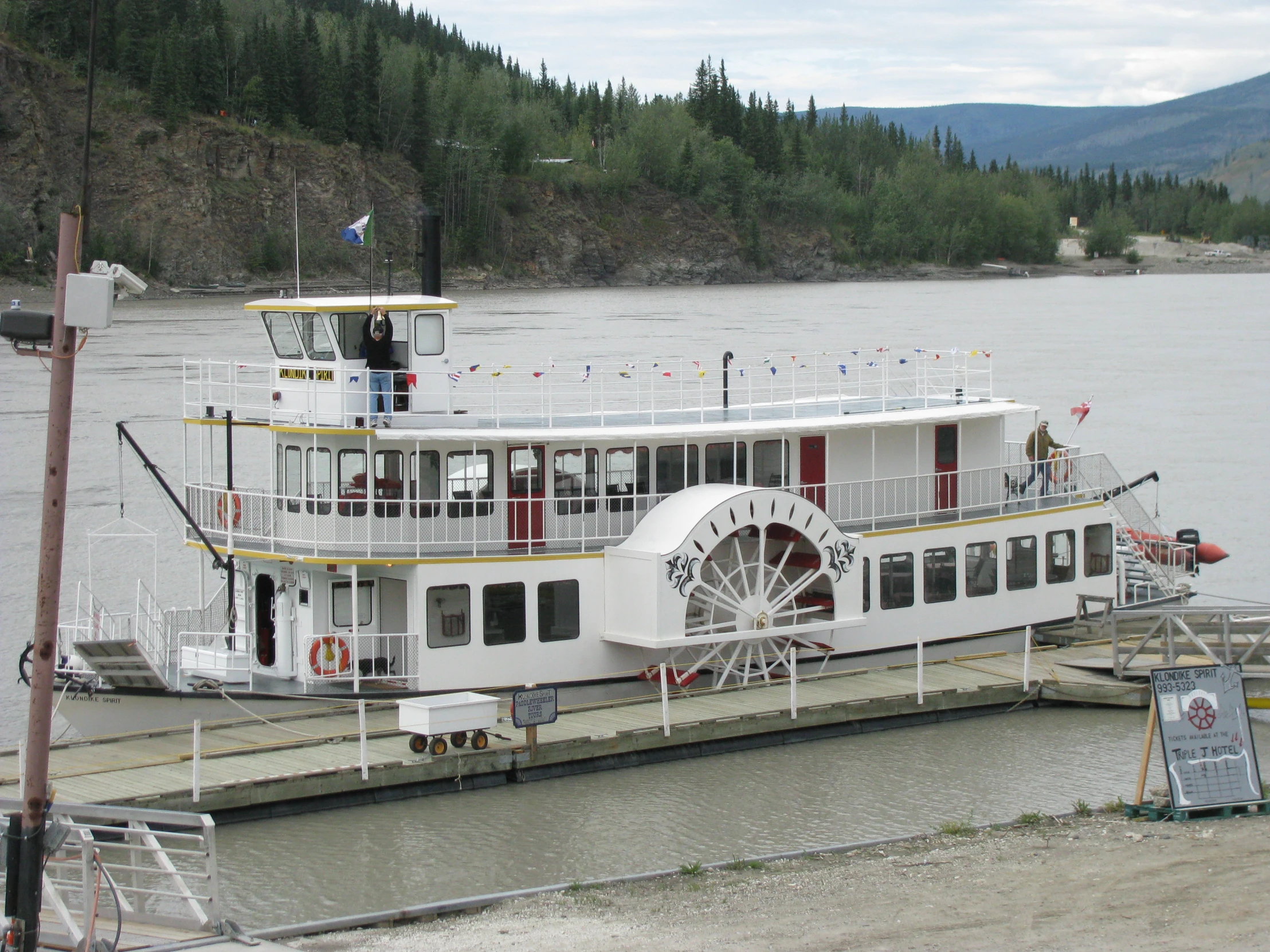 a boat with a large paddle on top of it