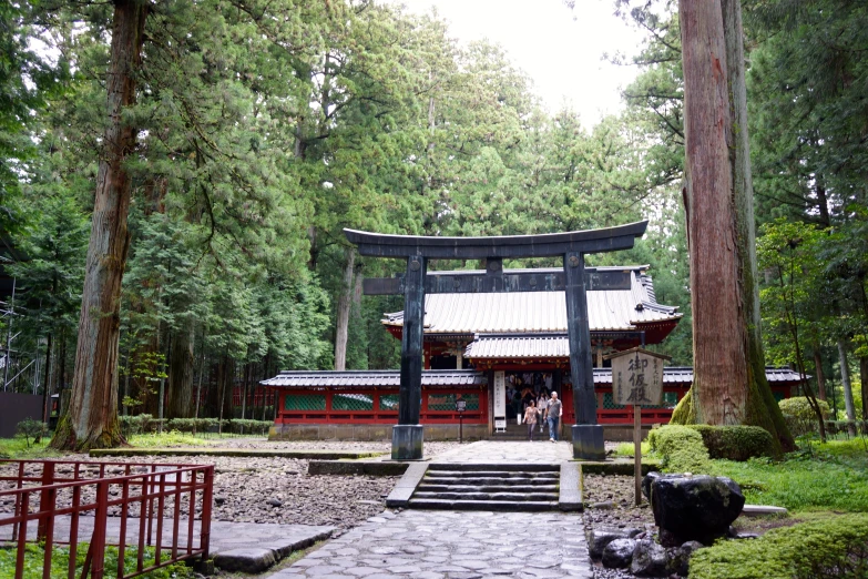 a chinese building in the middle of a small yard