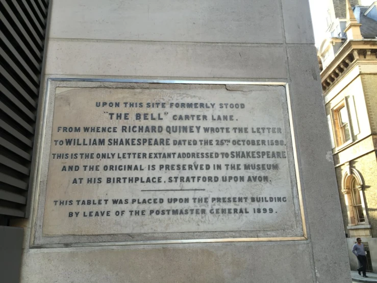 the plaque that stands in front of the building