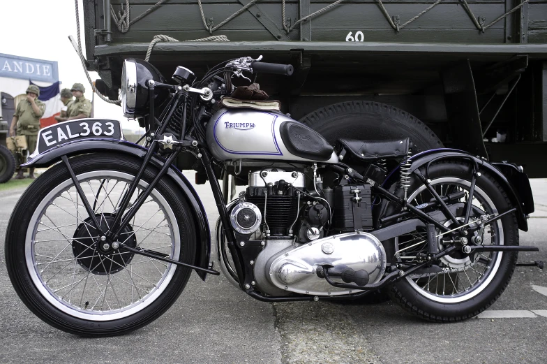 a black and white pograph of a vintage motorcycle