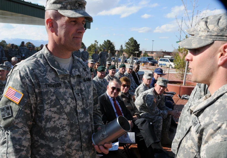 the men in uniform are talking to each other