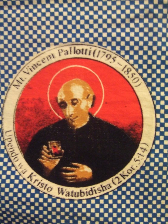 an icon painted on a wall, depicting an old priest