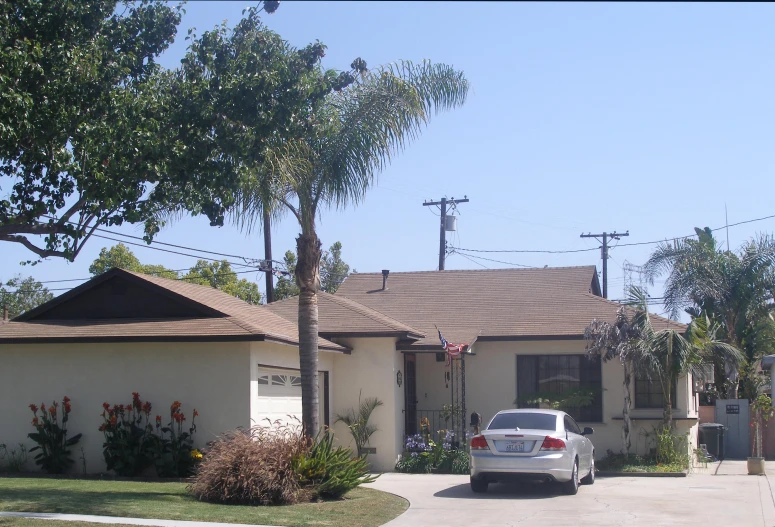 a house with a car parked in the driveway