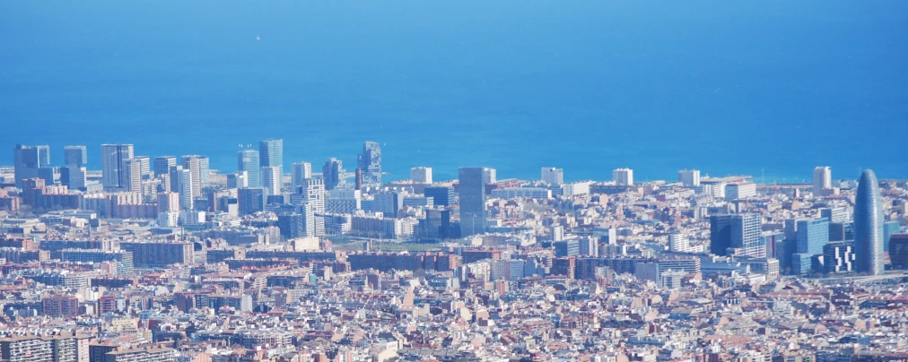 an aerial view of the city and the ocean