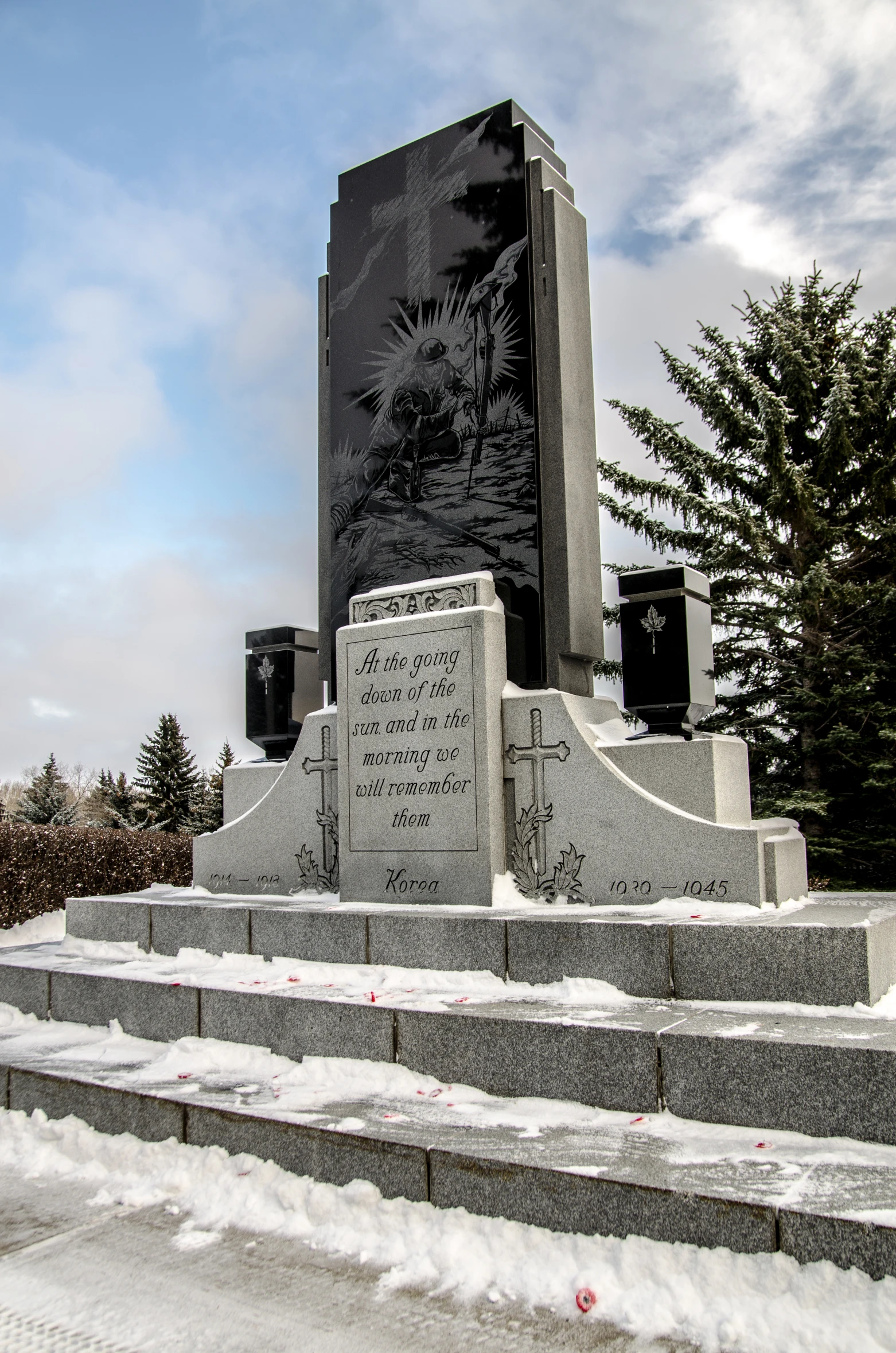 a monument covered in snow on a hillside