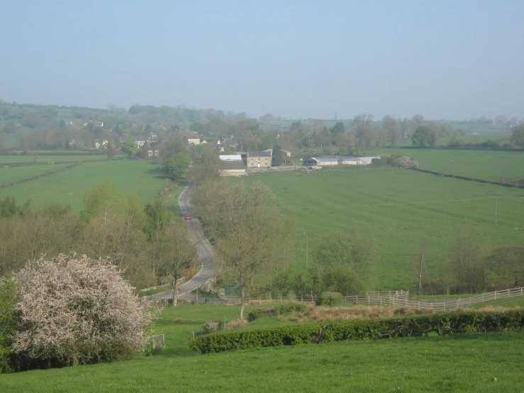 a view of a rural countryside and pasture