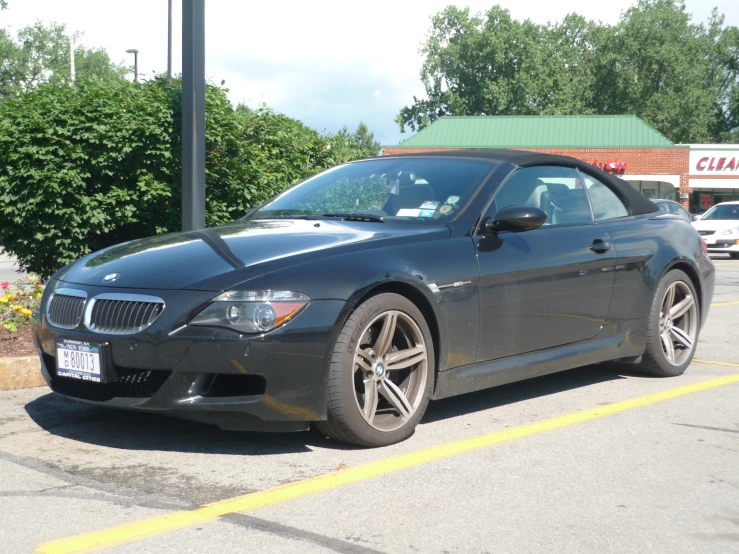 a black car parked in the parking lot