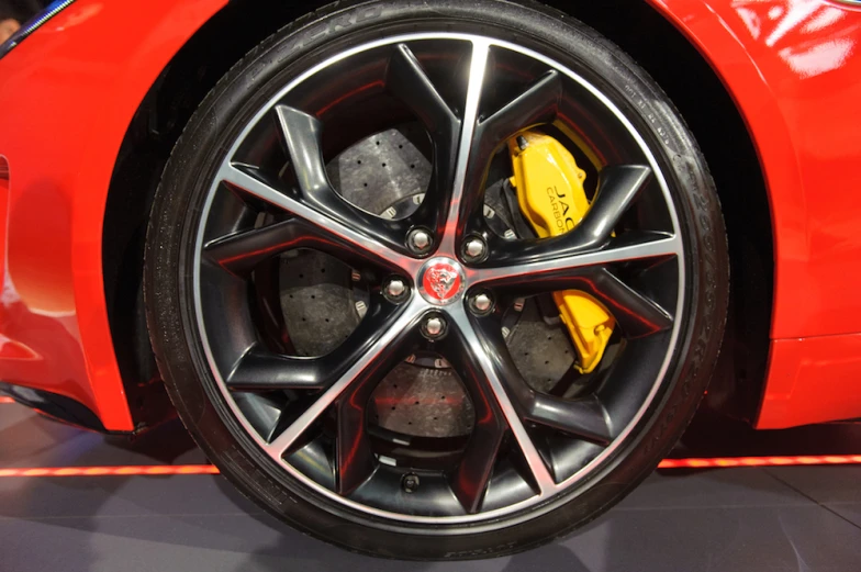 the wheels and ke discs of a red sports car