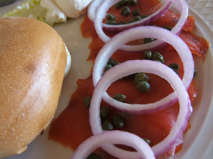 a sandwich, beans and bread on a plate