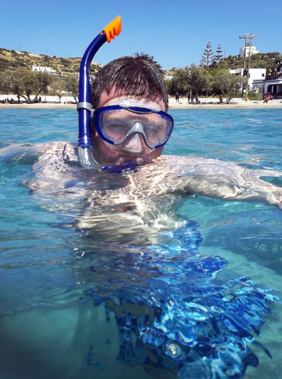 a person in the water wearing a snorkeld mask