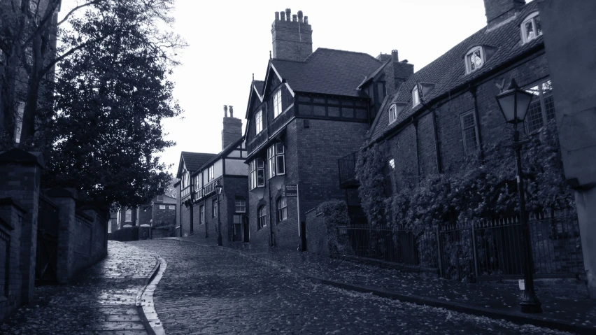 black and white po of a street with houses in the background