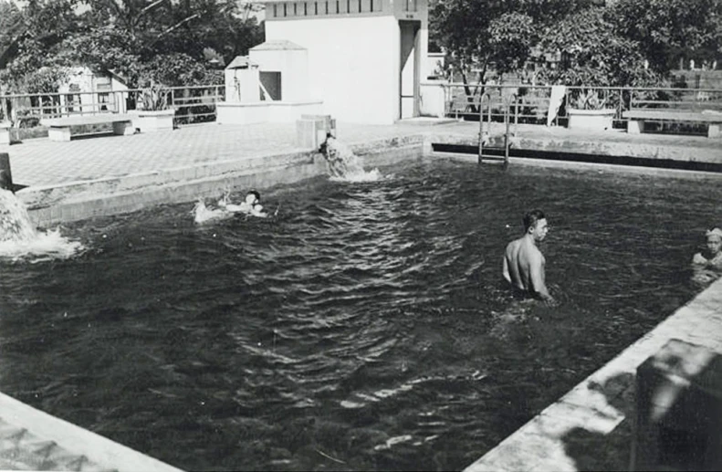 a group of people in an old swimming pool