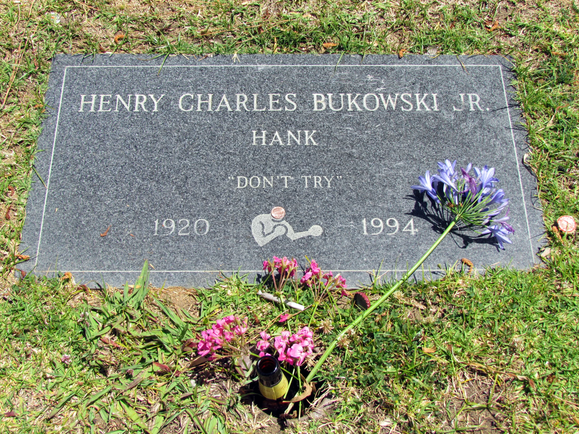 a grave marker sits outside on the ground