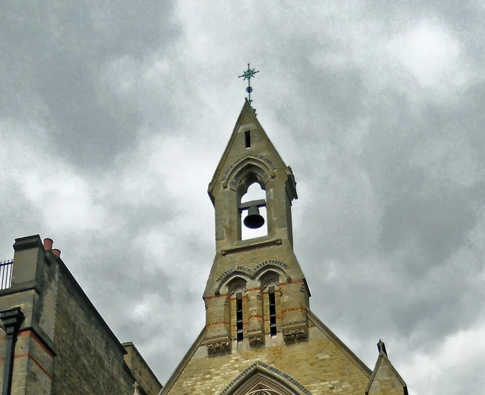 there is an old tower with a bell on the top