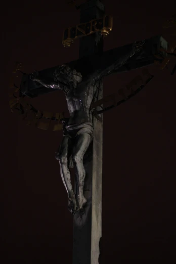 the person on the cross is  with chains