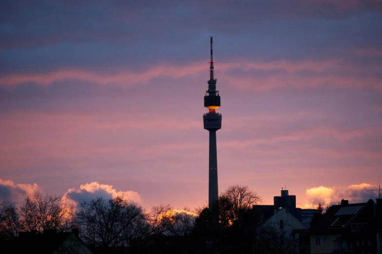 a very tall tower sitting in the middle of a city