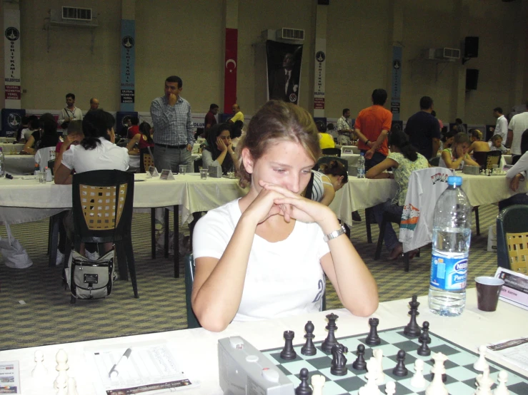 woman sitting at table playing board games at gathering