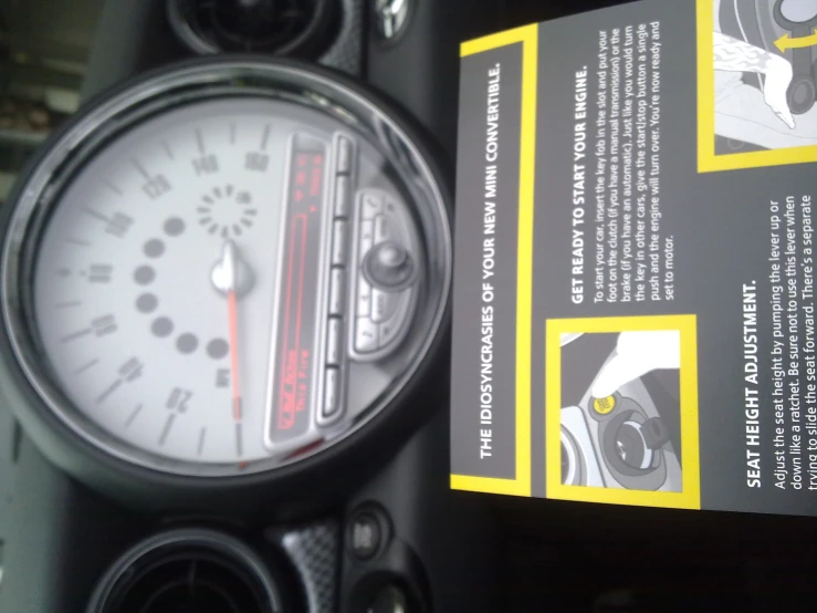 closeup of an old car manual showing a meter