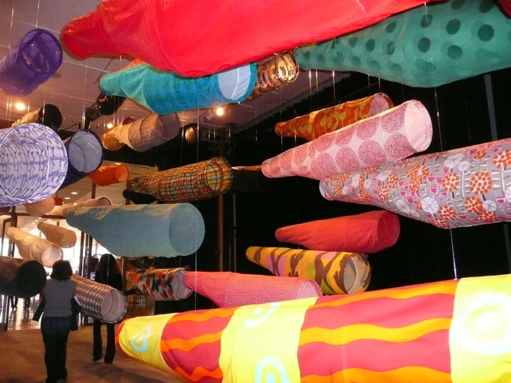 there are many large colorful items hanging from the ceiling