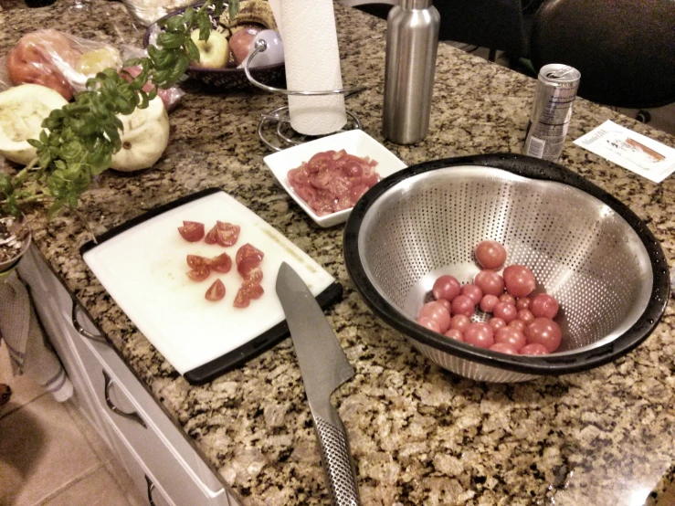 some tomatoes are being cut up in a set on a counter