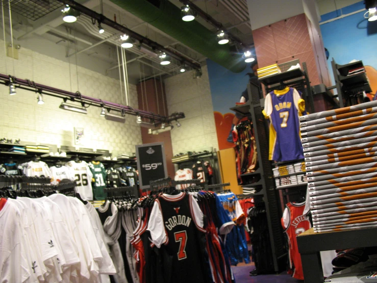 sports jerseys are shown on racks at a store