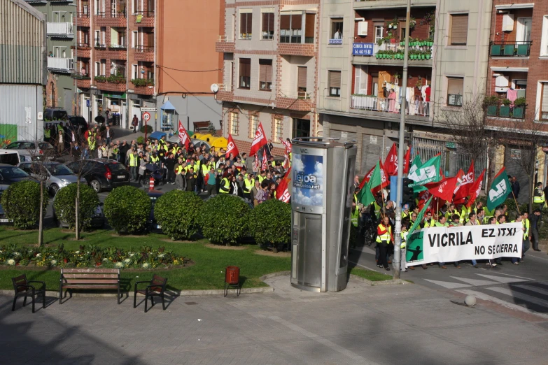 a large field of flags on the sidewalk