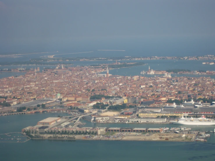 an aerial view of some buildings on water