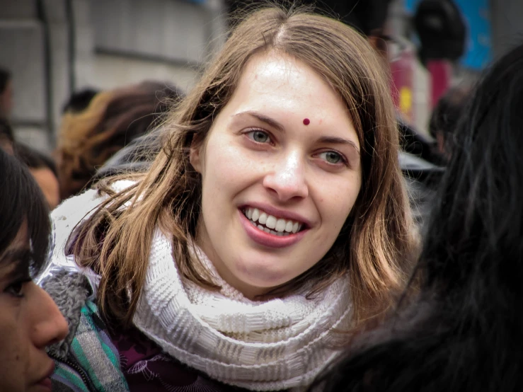 a close up of a person smiling at the camera