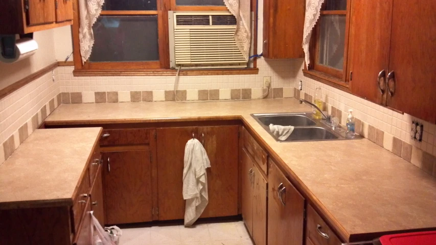 the view of a small, clean kitchen from outside