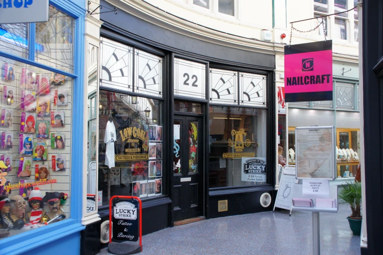 a store with a wall clock mounted to the front