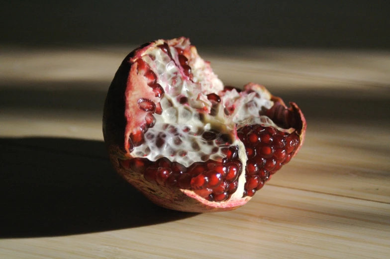 an orange sliced open with some fruit in it