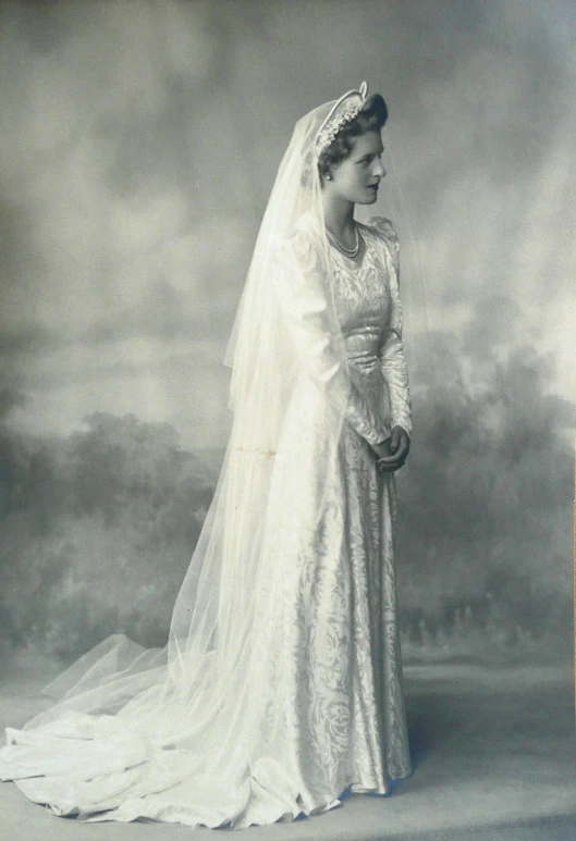 a vintage po of a lady wearing a white veil