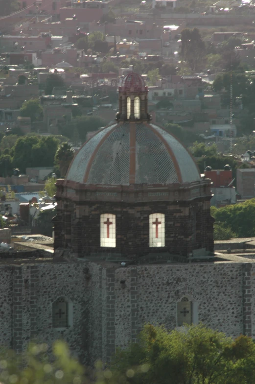 a large domed building with three crosses on it