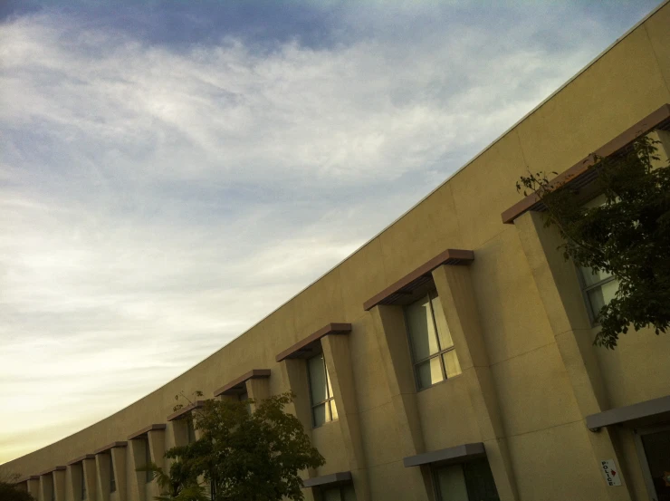 a clock is outside on the side of a building