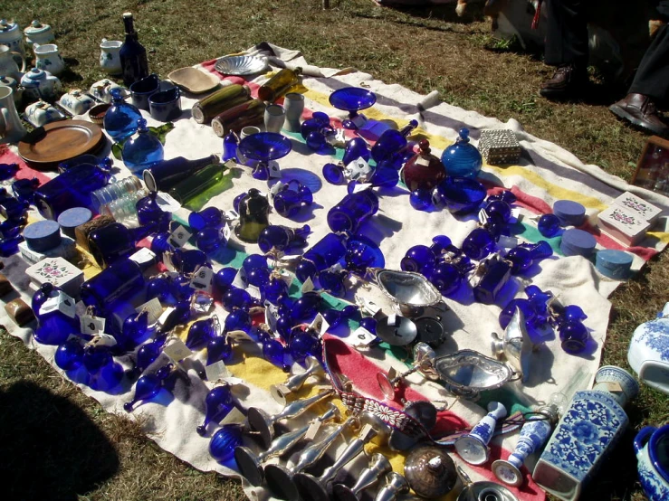 a pile of blue and yellow glass on a cloth