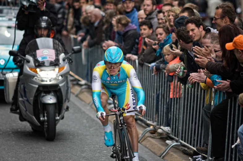 a person on a bike is getting into a crowd