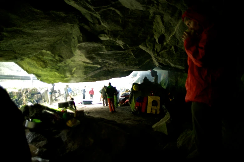 a group of people standing in a cave