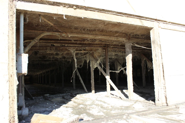 a wooden covered building with lots of ice