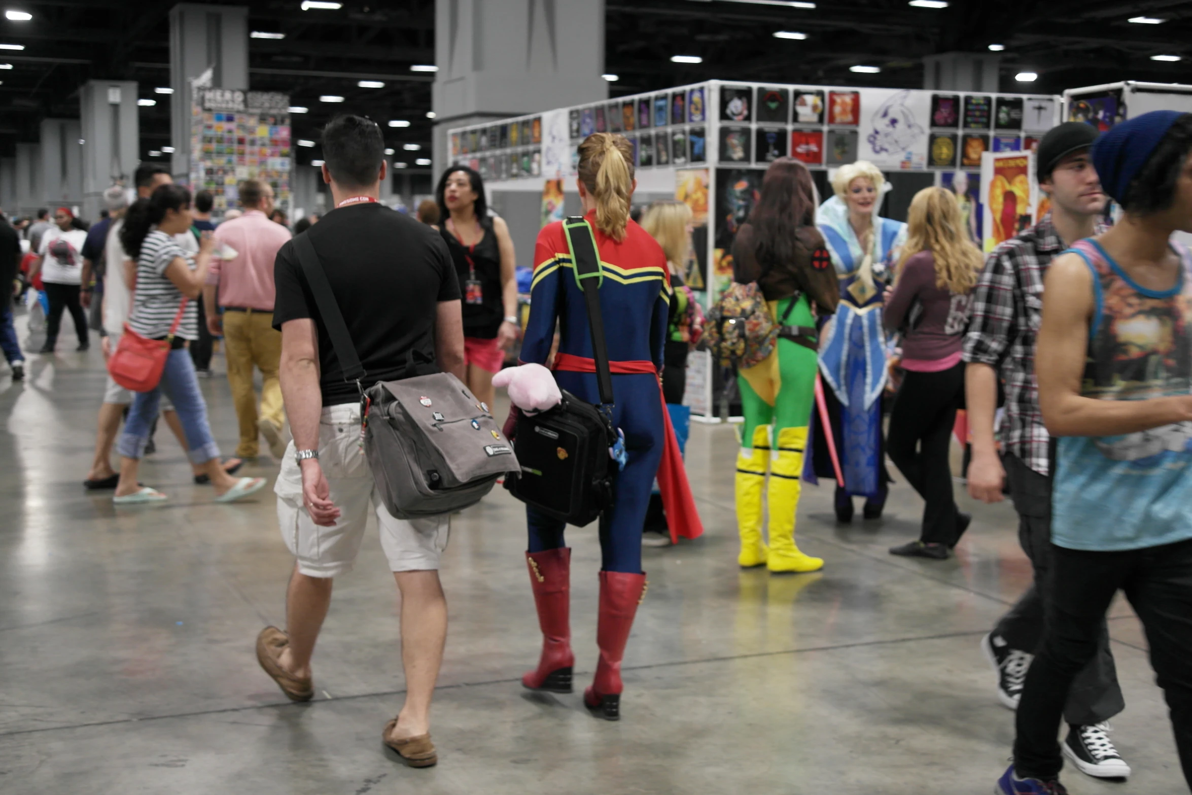 people walk around the exhibit in a convention