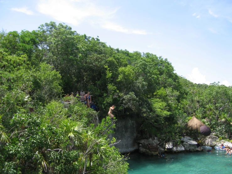 an island with a large cliff next to a body of water