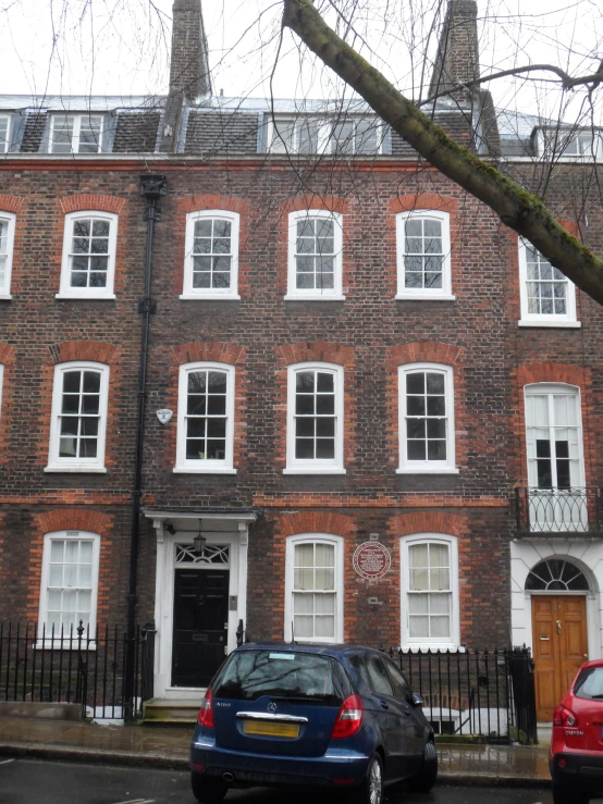 there is a large brick building with several windows