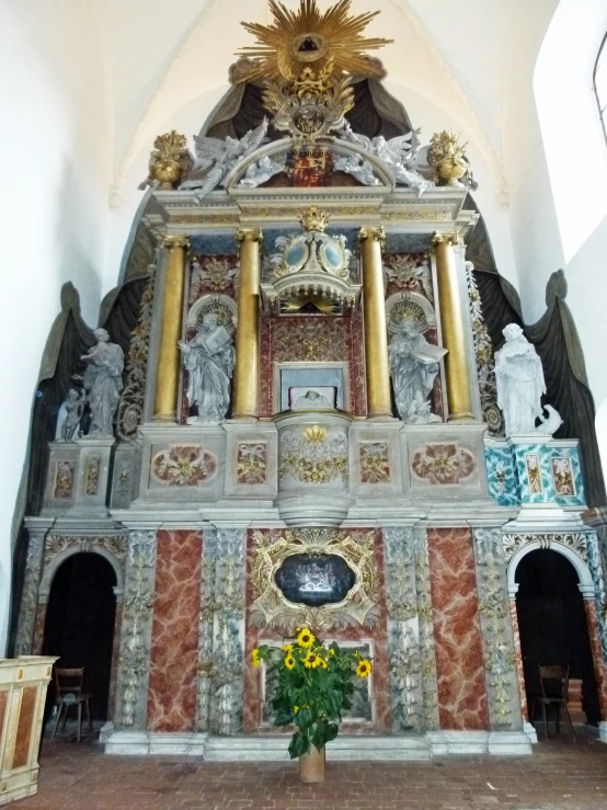a large church alter with an ornate wall