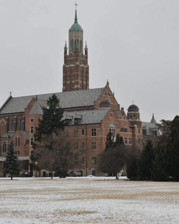 a large building with a clock tower in the background