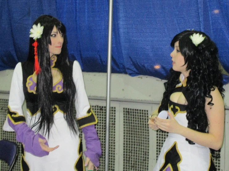 two women in costumes standing next to each other