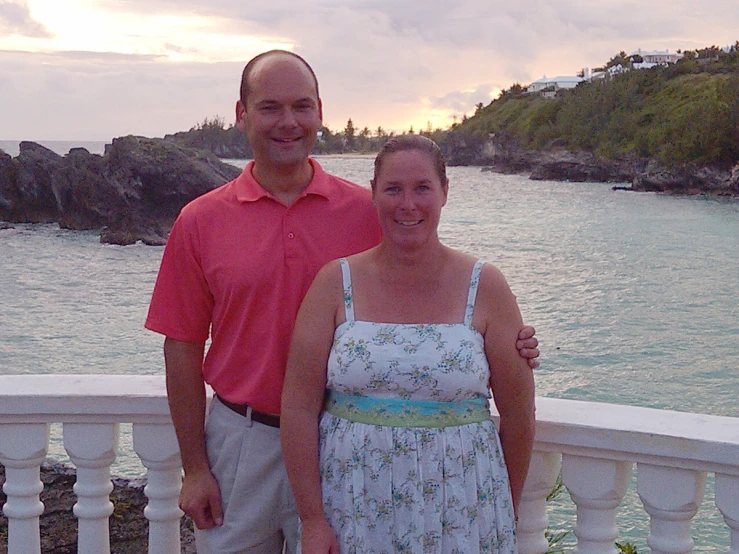 the man and woman are posing for a po