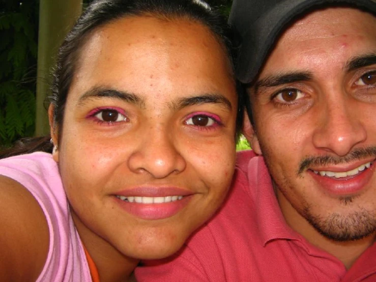 a man and a woman taking a selfie