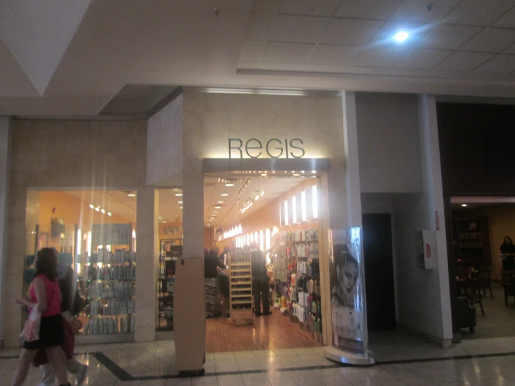 a storefront with the entrance lighting up and customers entering